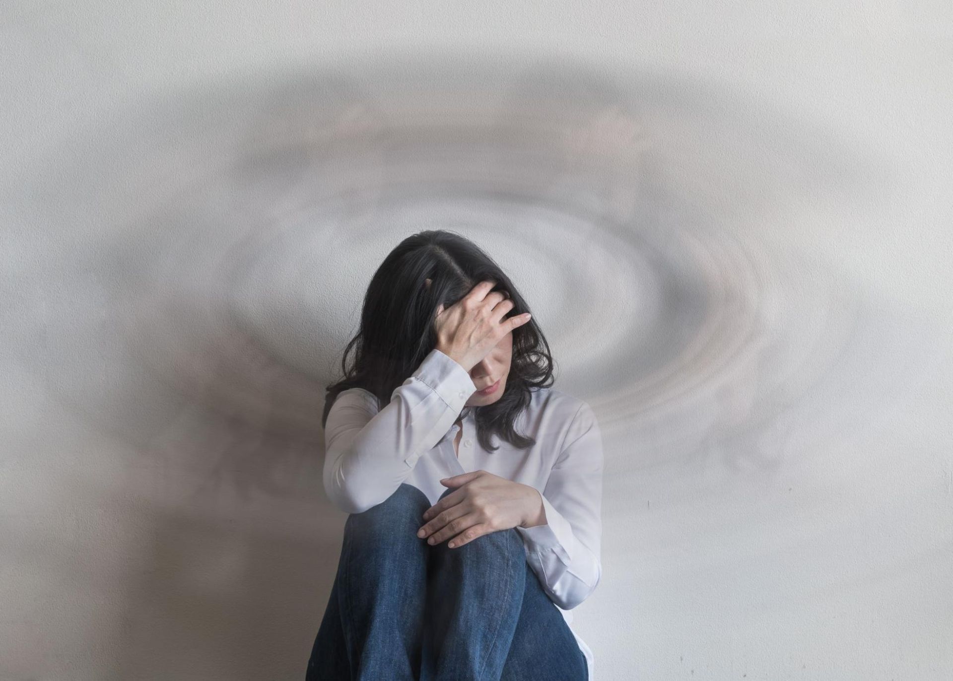 a woman having headache with too much cbd